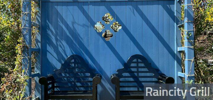 Wooden Chairs under Blue Pergola